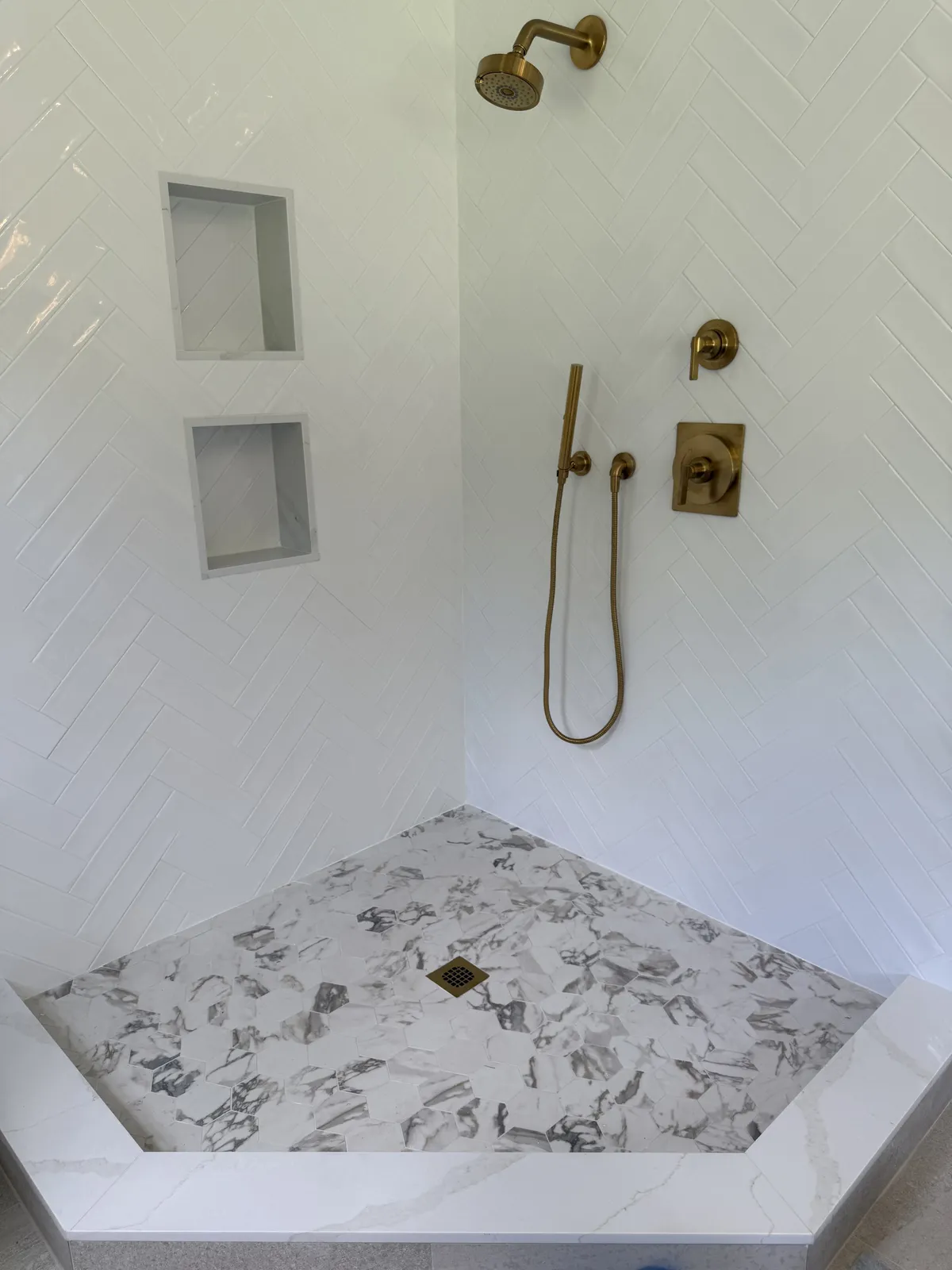 Tiled shower installation by Milford Mills Tile